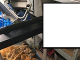 an image of a kitchen with a stove and pans in it