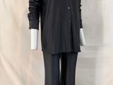 the mannequin is wearing a black shirt and black pants