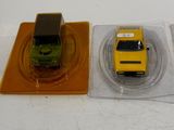 three toy cars that are sitting on a plastic tray