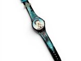 a close up of a wrist watch with a picture of a woman on it