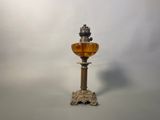 a glass lamp that is sitting on a table
