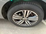 a close up of a car ' s tire on the street