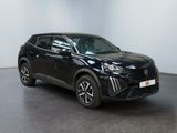 a black toyota rav parked in a large room