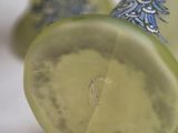 a close up of a glass of lemonade on a table