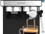 a close up of a coffee machine with a cup of coffee