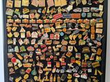 a picture of a picture of a fridge covered in pins and magnets