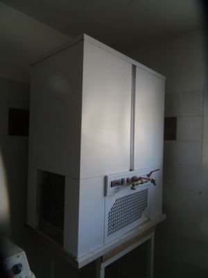 an image of a kitchen with a microwave on top of it