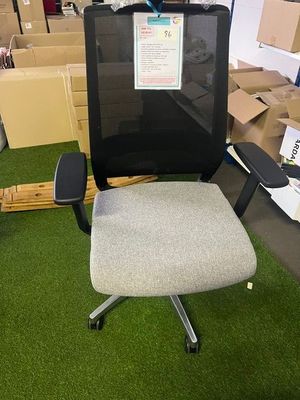 a chair that is sitting in the middle of a room