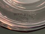 a close up of a glass bowl with a label on it
