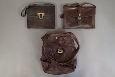 three bags that are sitting on a table