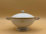 an image of a white and gold bowl with a lid