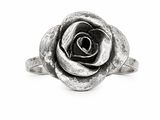 a close up of a silver rose ring on a white background