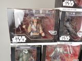 several star wars action figures are displayed in a display case