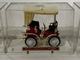 a small model of a car in a clear box