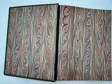 an open book with a pattern on it sitting on a table