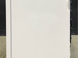 an image of a white refrigerator with a blue sticker on the door