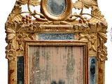 a picture of a gold frame with a mirror in it