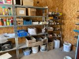 a room that has a lot of shelves and boxes on it