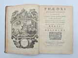 an open book with a picture of a man in a boat on it