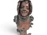 bronze bust of a child with a hood on his head