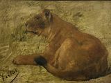 un tableau représentant un lion couché dans l'herbe