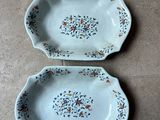 pair of vintage blue and white dishes with floral designs on them