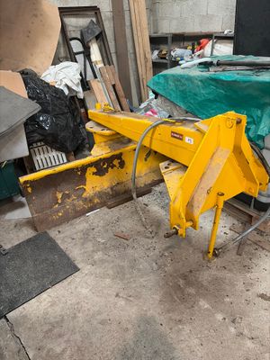 a yellow machine that is sitting in a garage