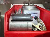 a red container filled with a bunch of kitchen utensils