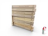 several books stacked on top of each other on a white surface