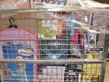 a cart with many items in it sitting in a warehouse