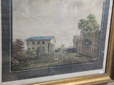 painting of a farm scene in a gold frame on a wall