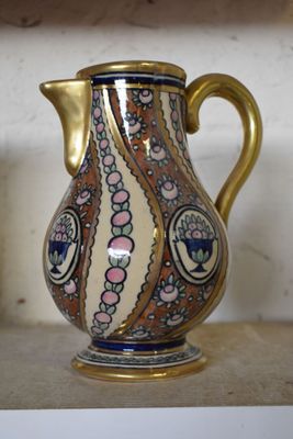 a vase that is sitting on a shelf in a room