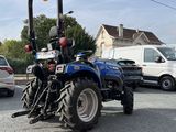 a tractor that is parked in the parking lot