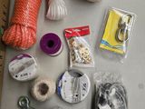 a table with a bunch of yarn, scissors and other items