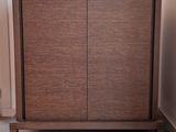 a wooden cabinet with a mirror on top of it