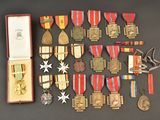 many medals and medals laid out on a table