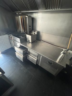 a large commercial kitchen with a lot of counter space