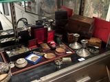 a display case with a lot of antique items on it