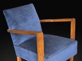 an image of a blue chair against a black background