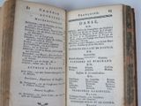 a book open on a table with a bunch of words on it