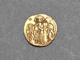 an image of a gold coin with an image of a man and a woman on it