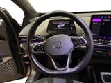 the interior of a car with a steering wheel and a touch screen