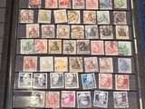 a picture of a collection of stamps on display in a glass case