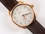 an image of a close up of a wrist watch on a white surface