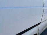 a white van parked on the side of the road