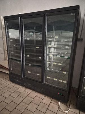 an image of a refrigerator in a store with its doors open