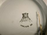 a white plate with a picture of a castle on it