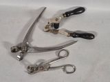 a pair of scissors and a pair of shears on a table