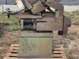 a machine that is sitting on a pallet in the grass