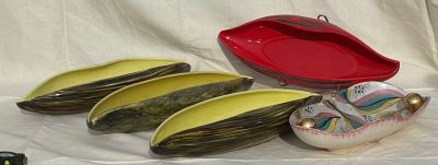three bowls and a bowl on a white cloth